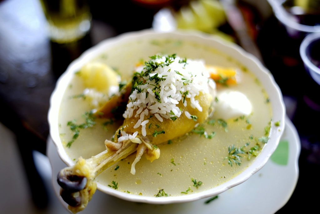 Chicken stock with root vegetables & garnish